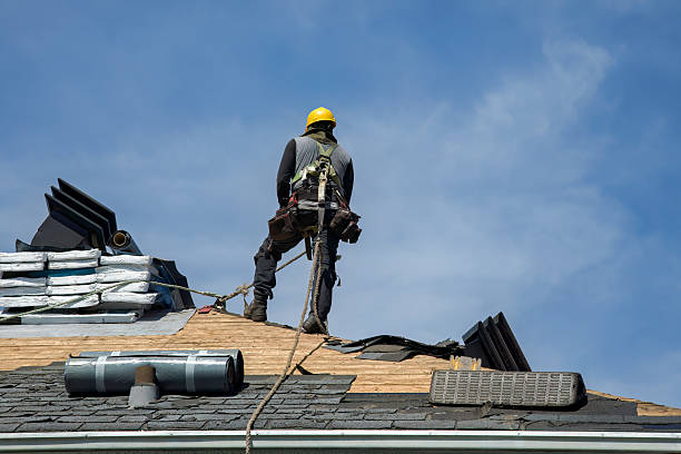 Professional Gutter Installation technician working in Stockbridge, MA